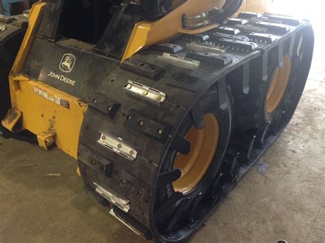 snow cleats for track skid steer|chains for tracks.